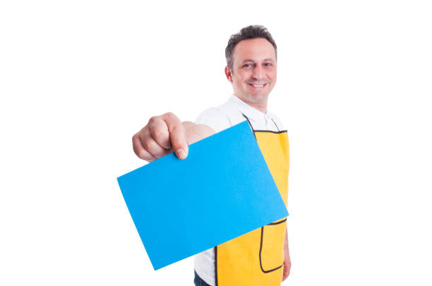 Hypermarket employee or worker holding blank paper with copy text space