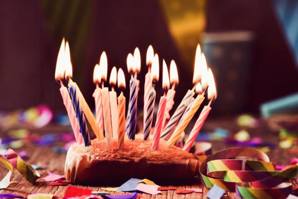 istock birthday cake with many lit candles 820465040