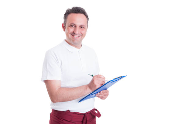 istock Happy salesperson or butcher making a checklist 820467160