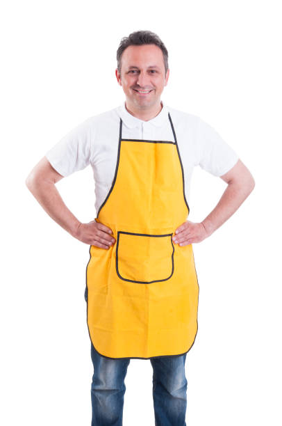istock Young man with yellow apron posing confident 820471512