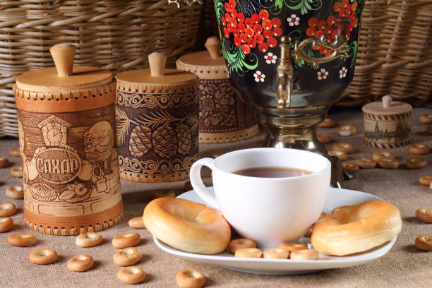 The samovar, a cup of tea, rolls and bagels.