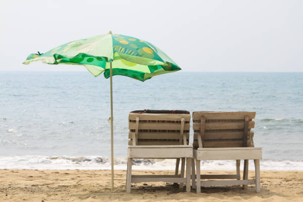 istock Chairs with Umbrella on the beach near ocean 820473090