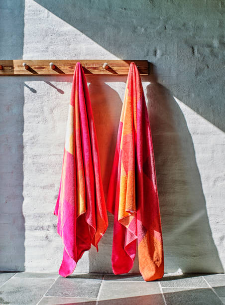 two red towels hanging in a spa two red towels hanging in a spa. hook of holland stock pictures, royalty-free photos & images