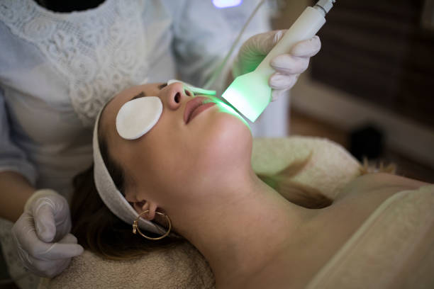 istock Young woman receiving laser treatment 820482648
