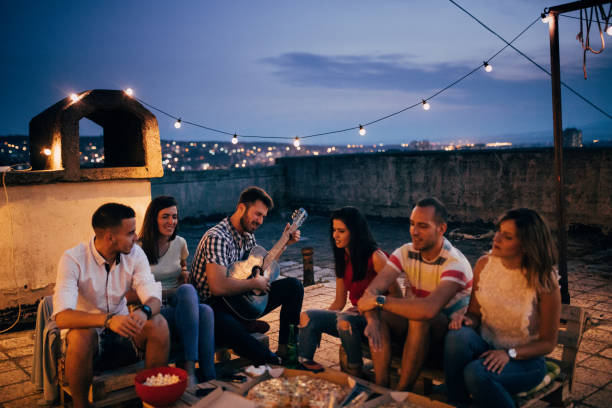 istock Friends at rooftop party 820486248