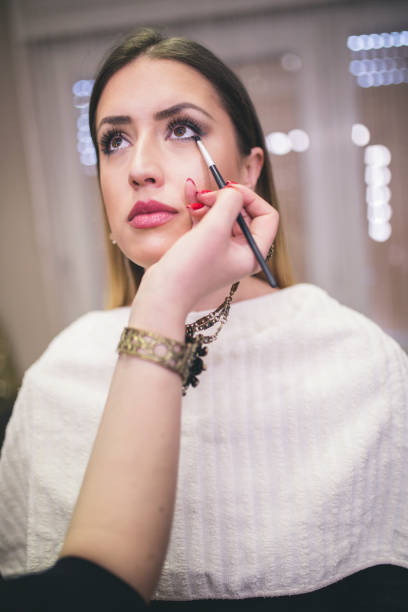 istock Make-up artist work on her friend.Real people. 820490530