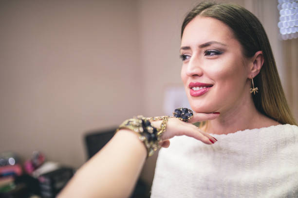 Make-up artist work on her friend.Real people.