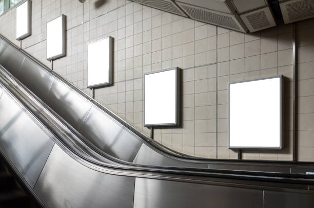 istock Blank billboard located in underground hall or subway for advertising, mockup concept, Low light speed shutter 820512118
