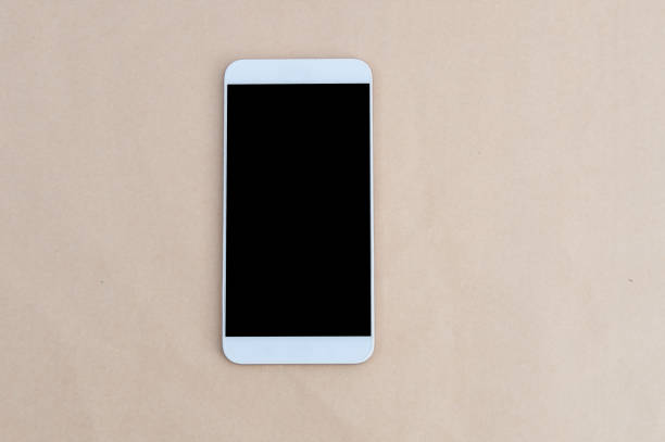 istock Smart phone on wooden background 820515006
