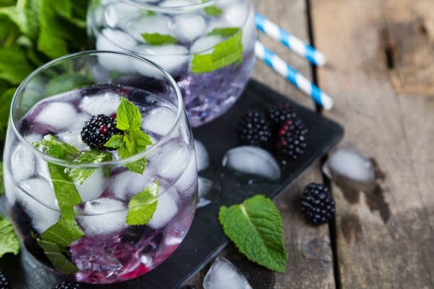 istock Blackberry mojito and ingredients on rustic background 820515314