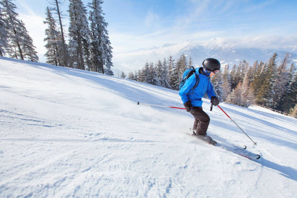 istock downhill skiing, skier in Alps 820520110
