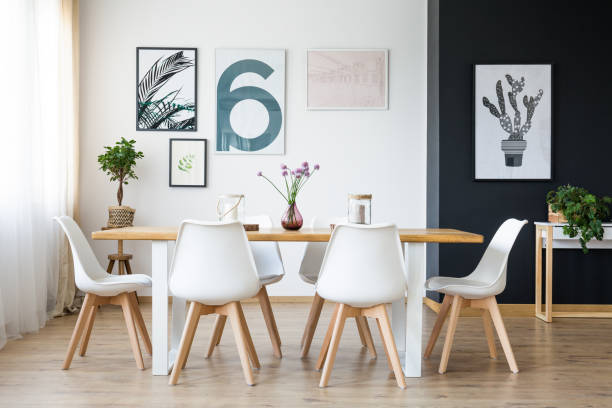 Table with chairs Set of wooden table with white chairs in cozy room scandinavian descent photos stock pictures, royalty-free photos & images