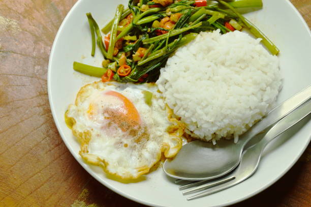 istock stir fried morning glory chop chili and egg with rice 820523094