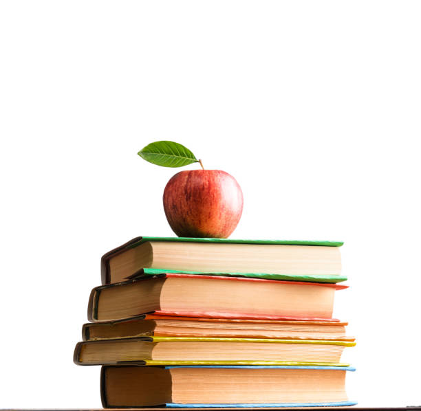 школьные аксессуары на белом - textbook book apple school supplies стоковые фото и изображения