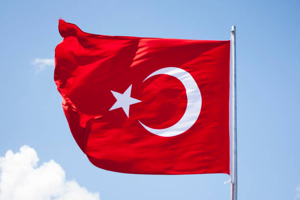 istock Turkish Flag Waving in Blue Sky 820535200