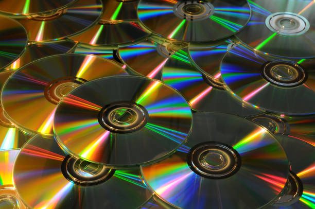 istock Close up of DVD and CD with postproduction effects. background. 820550944