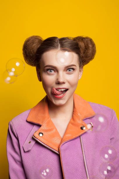 istock Girl licking lips staring wearing pink jacket 820557390