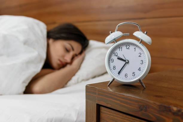 istock Young, handsome woman sleeping in a bed in her bedroom. 820558096