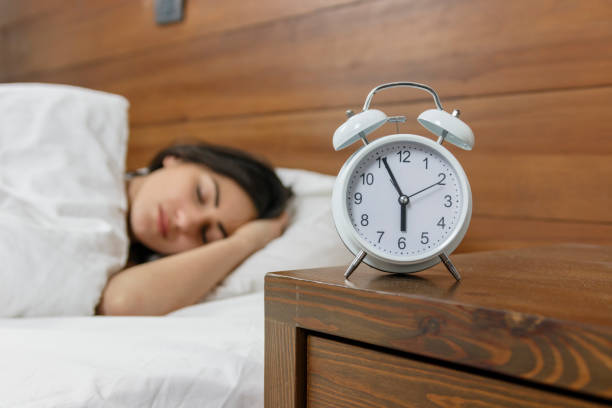 istock Pretty woman lying in bed at home 820560082