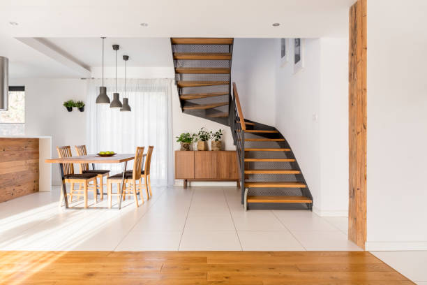 istock Half-landing stairs and wooden dining area 820569908