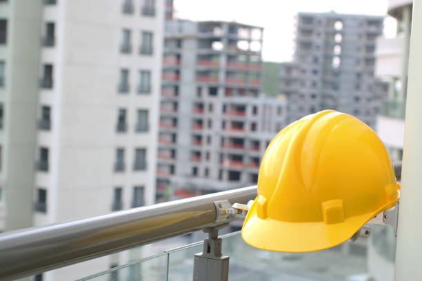 Yellow hard hat on construction site Yellow hard hat on construction site basement construction site construction blueprint stock pictures, royalty-free photos & images