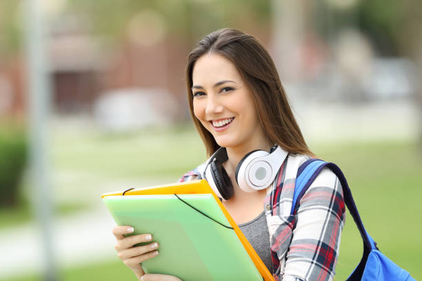 istock Student posing looking at you in the street 820570444