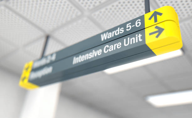 Hospital sign ICU A ceiling mounted hospital directional sign highlighting the way towards the intensive care unit - 3D render intensive care unit stock pictures, royalty-free photos & images