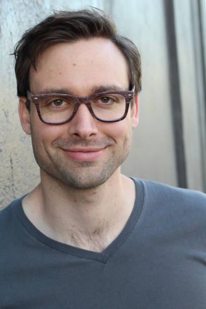 istock Natural good looking man with glasses smiling 820577694