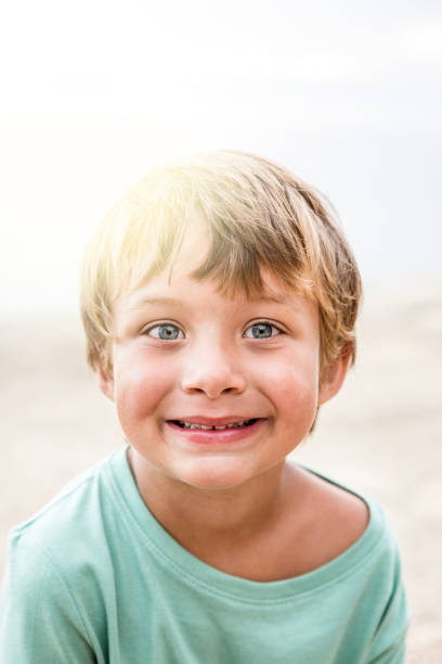 istock Pretty blond boy at the beach 820583582