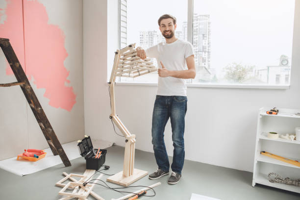 istock Young man does apartment repairment himself indoors 820584110