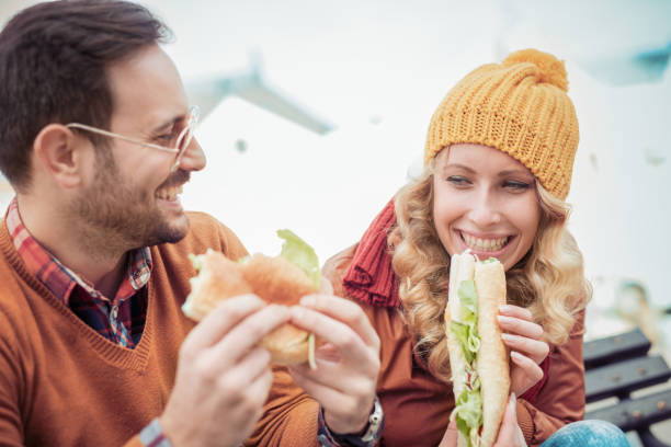 istock Friends eating sandwich 820588490