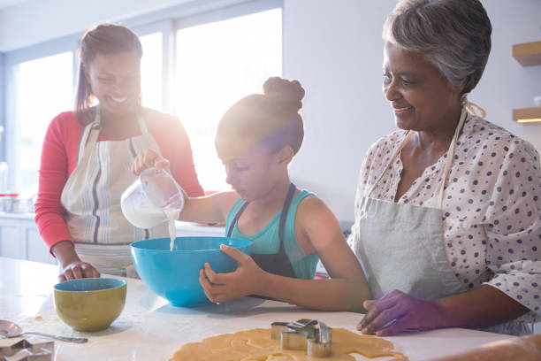 istock Happy multi-generation family preparing cookies in kitchen 820588520