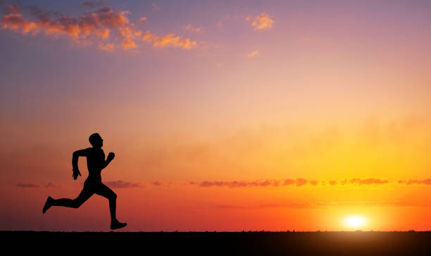 istock Running man silhouette in sunset time. Sport and active life concept 820588796