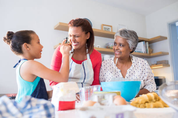 istock Happy family having fun in kitchen 820592214