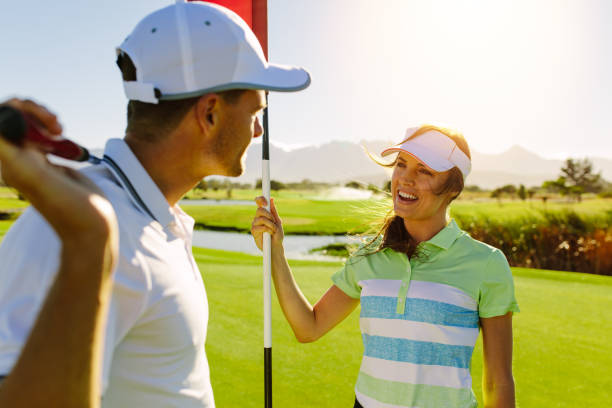 istock Golfing couple on the putting green at the golf course 820592682
