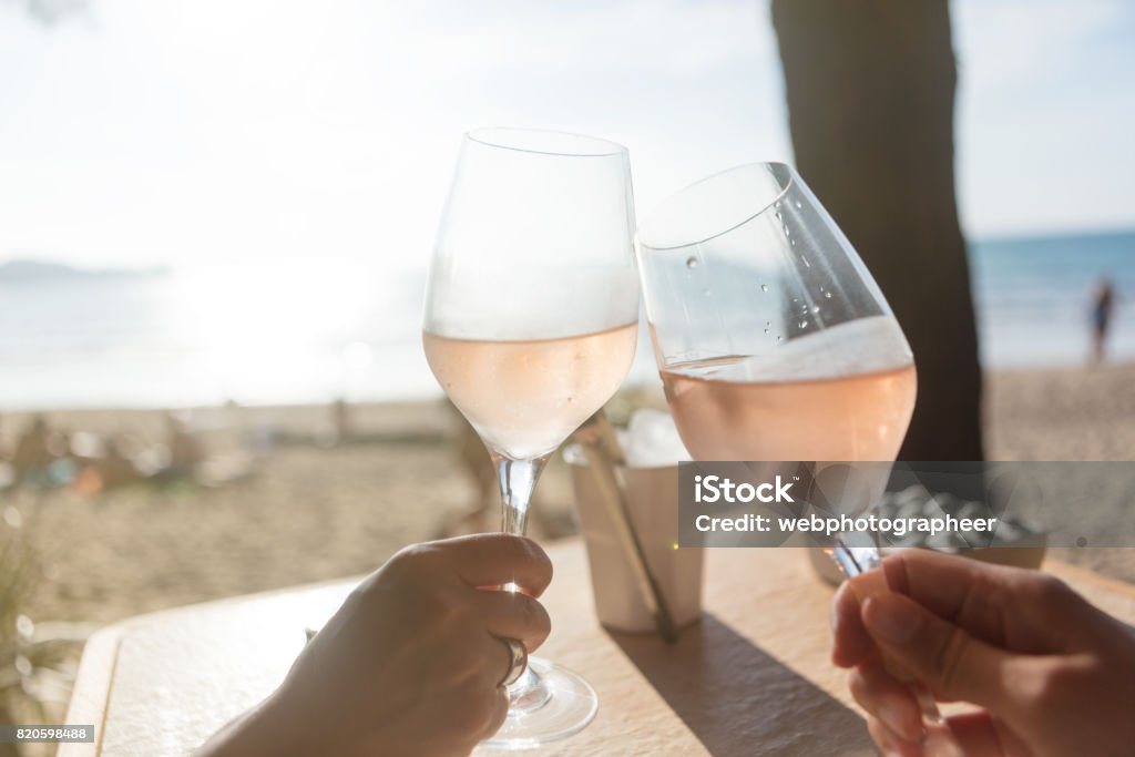 Raising a glass Raising a glass wit rose wine Rosé Wine Stock Photo