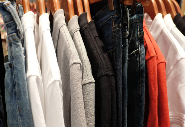 istock Clothes hanging on rack in shop. 820598942
