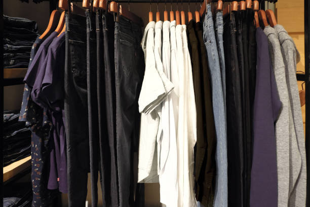 istock Clothes hanging on rack in shop. 820599076