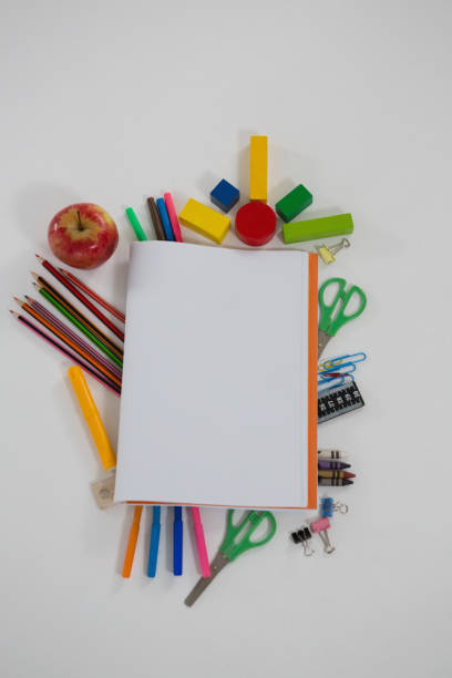 istock Various school supplies arranged on white background 820599280