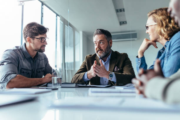istock Successful businessman discussing with team in meeting 820608914