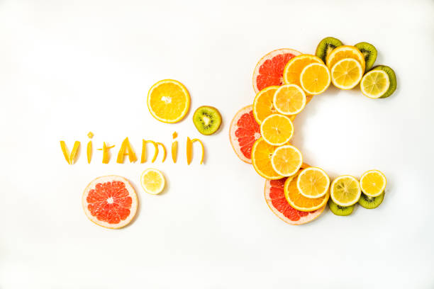 Vitamin C letters made of citrus fruits Vitamin C letters made of citrus fruits - lemon, grapefruit, orange and kiwi slices on white background caucasus photos stock pictures, royalty-free photos & images