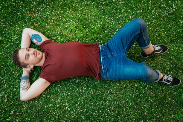 istock Young man enjoying resting in park 820618988