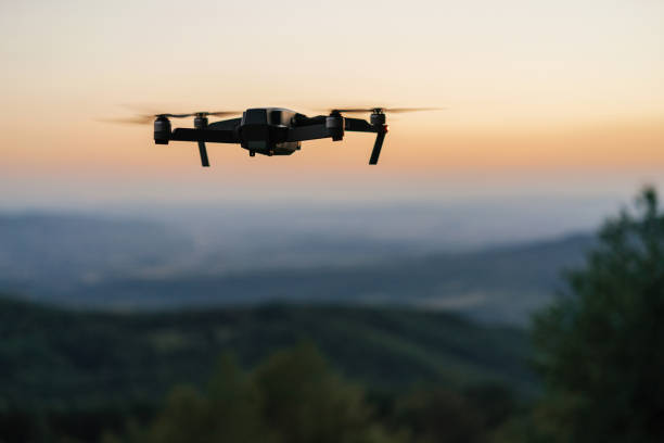 Flying drone Flying drone at dusk drone point of view stock pictures, royalty-free photos & images