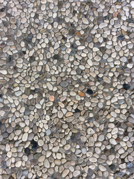 istock path made of small round stones 820647806
