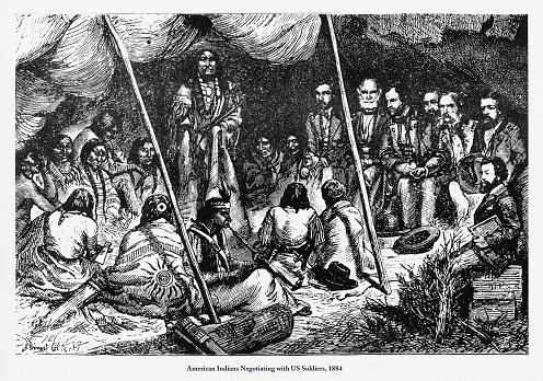 Beautifully Illustrated Antique Engraved Victorian Illustration of American Indians Negotiating with US Soldiers Engraving, 1884. Source: Original edition from my own archives. Copyright has expired on this artwork. Digitally restored.