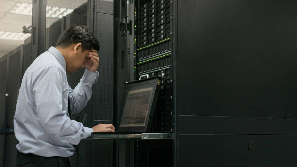 Administrator serious working with system in data center stock photo