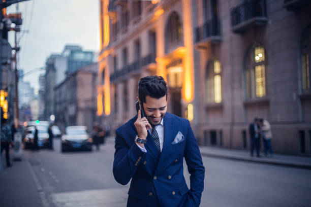 istock Smiling businessman with a mobile phone 820667326
