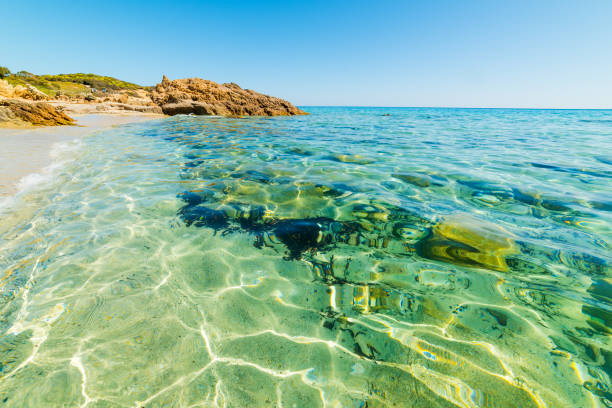 istock Crystal clear water in Santa Giusta shore 820673672
