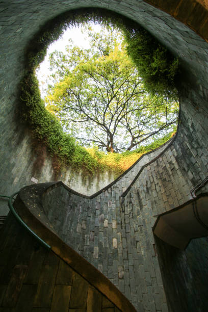 Spiral staircase of underground crossing in tunnel at Fort Canning Park, Singapore. stock photo