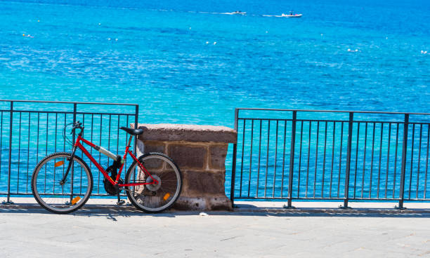 istock Mountain bike by the sea in Alghero seafront 820678110